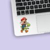 Custom Red Game Hero Riding a Green Dinosaur Face Cutout – Sticker Custom Red Game Hero Riding a Green Dinosaur Face Cutout shown on a sticker mockup