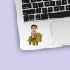Custom Green Triceratops Explorer Rider Face Cutout – Sticker Custom Green Triceratops Explorer Rider Face Cutout shown on a sticker mockup