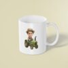 Custom Farmer Driving a Green Tractor Face Cutout – Mug Custom Farmer Driving a Green Tractor Face Cutout shown on a mug mockup