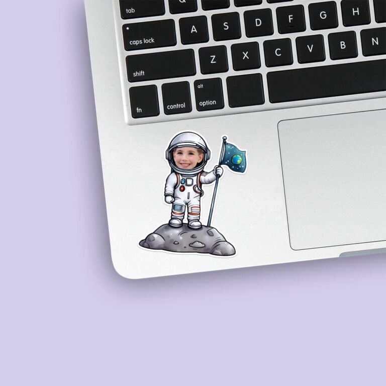 Custom Astronaut Planting a Space Flag Face Cutout – Sticker Custom Astronaut Planting a Space Flag Face Cutout shown on a sticker mockup