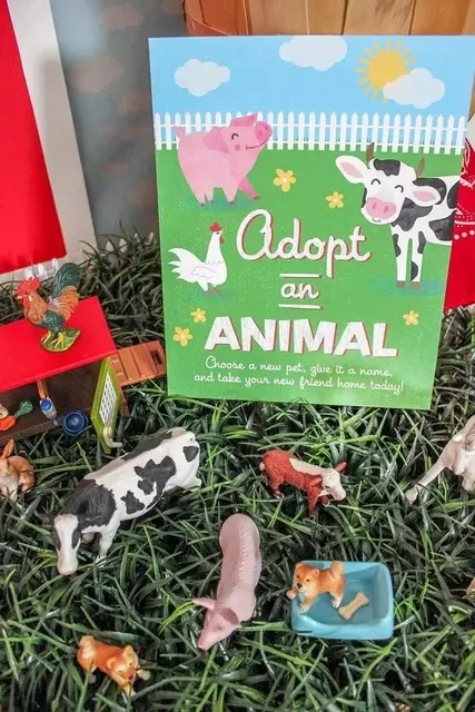 Farm Animal Figurine Display with an Adoption Sign
