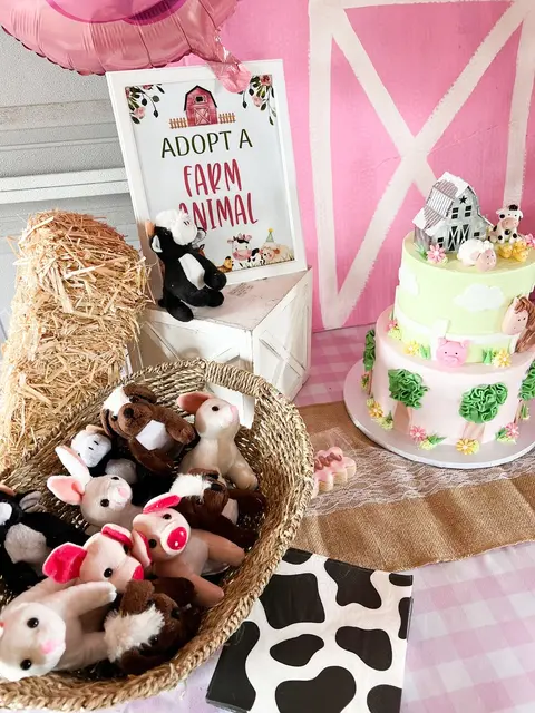 Pink Farm Cake Table with a Plush Animal Favor Basket