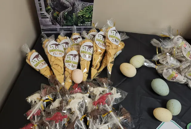 Dinosaur Treat Table with Snack Cones and Speckled Eggs