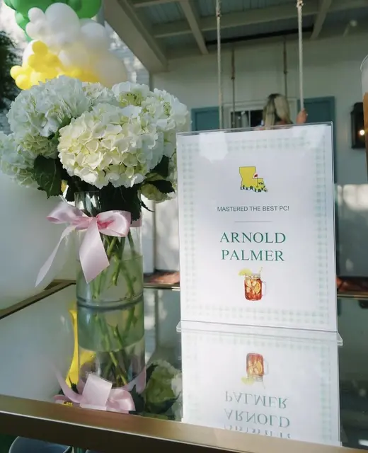 Arnold Palmer Drink Sign with White Flowers and a Pink Bow