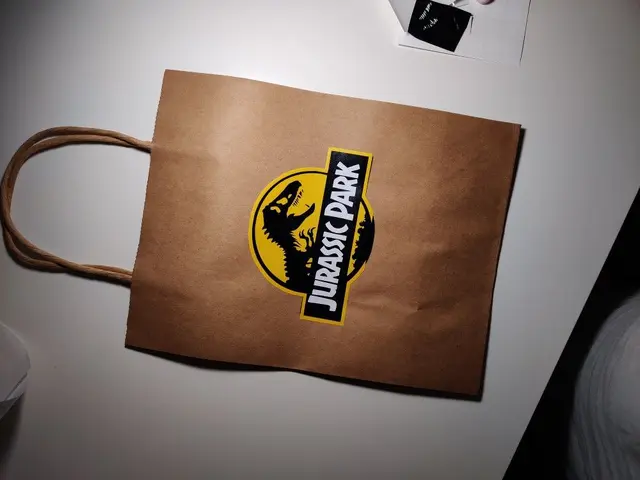 Jurassic Park Favor Bag with a Yellow and Black Logo