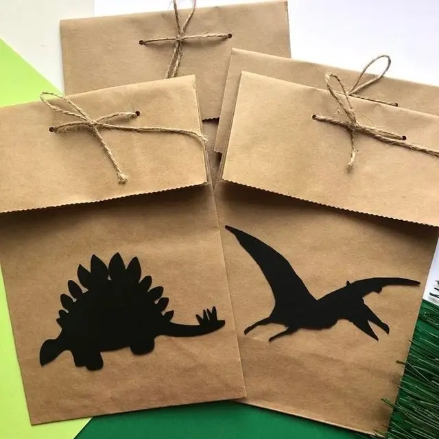 Black Dinosaur Silhouettes on Twine-Tied Favor Bags