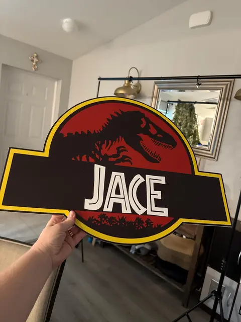 Dinosaur Name Sign with a Red and Black Emblem