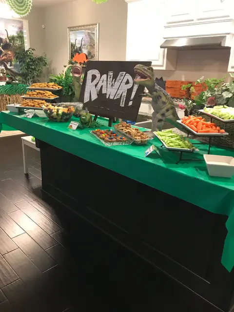 Dinosaur Buffet with a Bold RAWR Sign