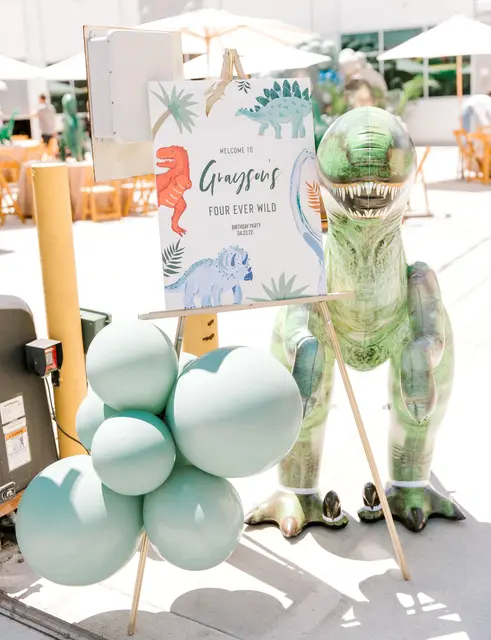 Four Ever Wild Welcome Sign with Dinosaur Balloon