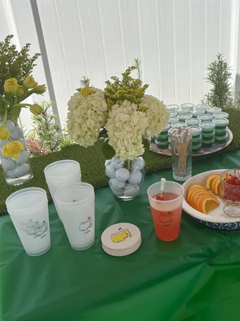 Golf Ball Vase Centerpiece with White and Yellow Flowers