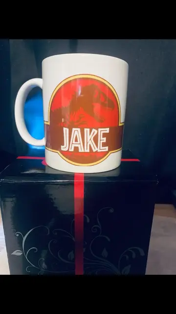 Personalized Dinosaur Mug with a Red and Yellow Emblem