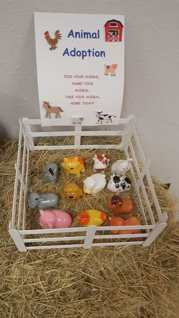 Toy Animal Adoption Station with a Small White Fence