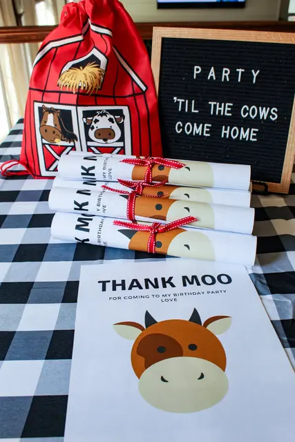 Farm Party Favor Rolls with Cow Designs and Red Ribbon