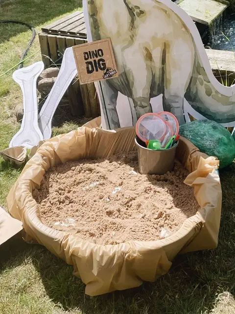 Dino Dig Pit with Bone and Dinosaur Cutouts