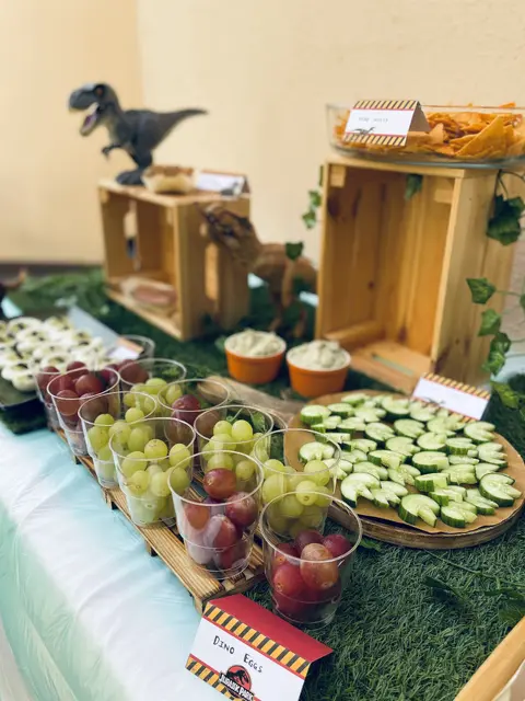 Dinosaur Snack Table with Grape Cups and Wooden Crates