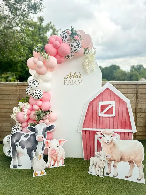 Pink Farm Backdrop with a Barn and Cow-Print Balloons