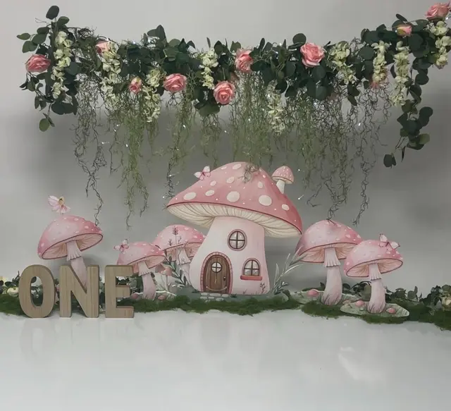 Pink Mushroom Cottage Table Display with a Floral Garland
