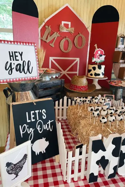 Red Barn Dessert Table with Cow Print and a MOO Banner