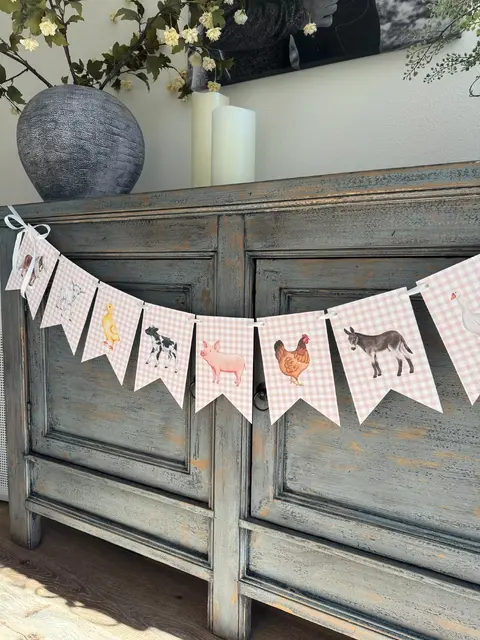 Pink Gingham Farm Animal Banner on a Rustic Cabinet