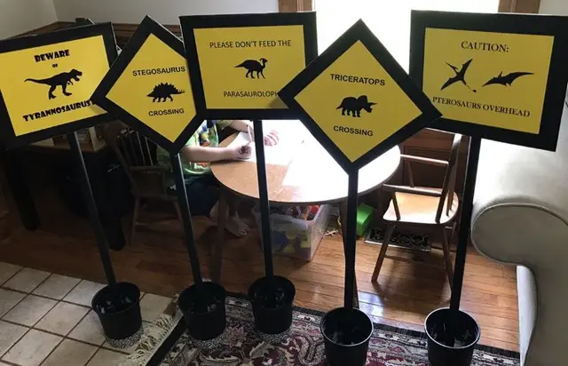Yellow Dinosaur Warning Signs in Black Pots