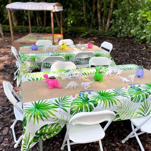 Dinosaur Painting Tables with Tropical Leaf Covers