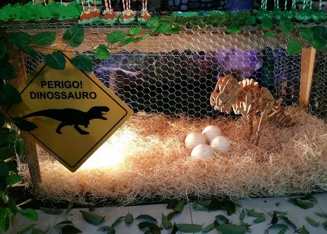 Dinosaur Nest Display Beneath a Dessert Table
